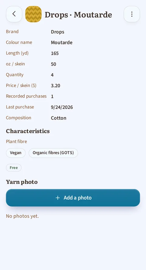 The full-screen page for Drops · Moutarde: brand Drops, length 165 yd, 50 oz a skein, quantity 4 at $3.20 a skein, one recorded purchase, the last on 9/24/2026, composition Cotton, then Plant fibre, the Vegan and Organic fibres (GOTS) tags, the Free state and the Add a photo button